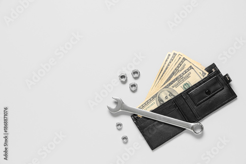 Wallet with money and plumb...