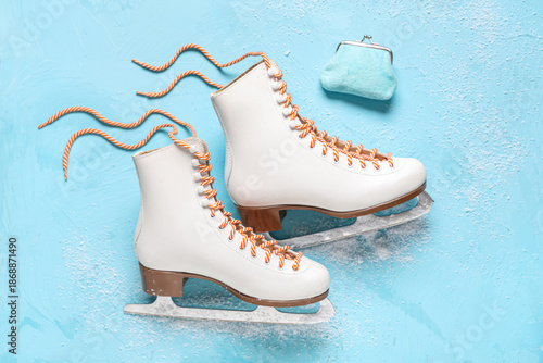 Wallet with ice skates on b...