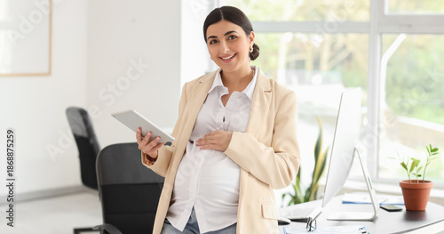Pregnant businesswoman with...