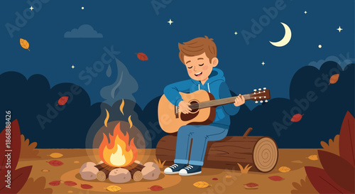 Smiling young man playing an acoustic guitar by a campfire.