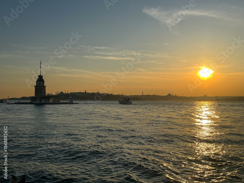 Sunset over the Maiden's Tower or Kiz Kulesi in the middle of the Bosphorus strait in Istanbul.
