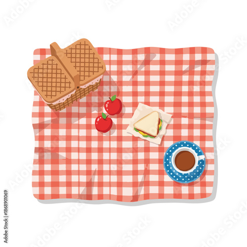 Picnic on a red checkered blanket with food and drink