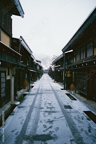 Old traditional Japanese houses under the blizzard in Takayama