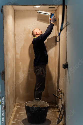 Worker applying hermetic seal 