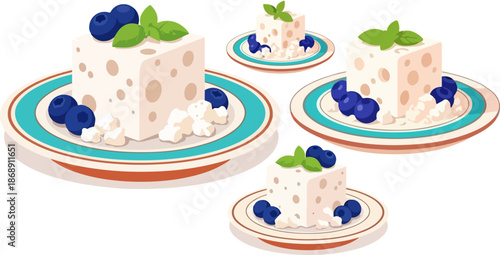 Four servings of creamy white cheese dessert blocks decorated with fresh blueberries and mint leaves on white background