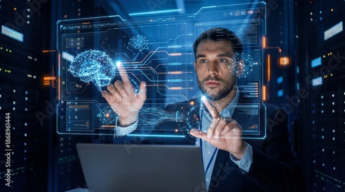 Businessman operating futuristic holographic interface in a data center with laptop © DesignSells