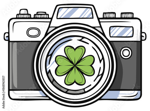 Retro camera with a green four leaf clover in the lens showing good luck and photography