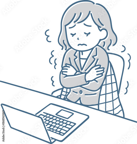 オフィスで寒さに震える女性