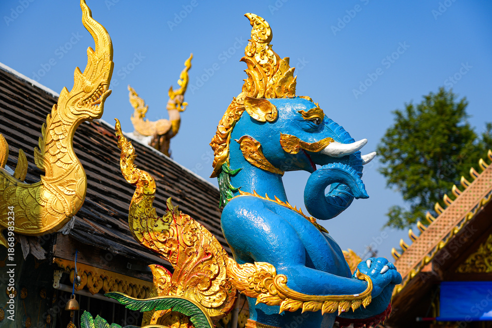 Fototapeta premium Sacred Hasadelee statue, a mythical elephant-headed bird at Wat Phra That Doi Kham temple on the mountain side of Chiang Mai, Northern Thailand