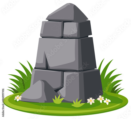 Stacked gray stone structure with green grass, plants, and flowers.