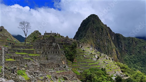 Machu Picchu circuit one morning shihuahuaco tree chihuahuaco Peru Perú aerial sunny blue sky clouds rainy season lush green jungle Huayna Picchu mountain Peruvian Andes Inca Temple Sanctuary circuit