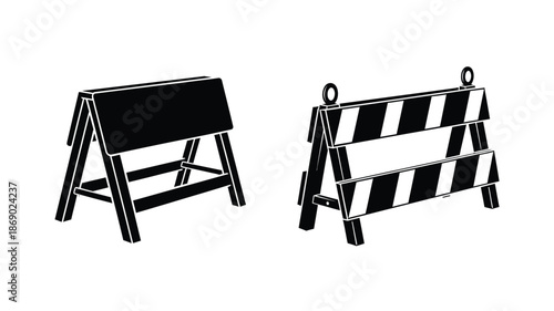 Two construction barriers one solid black and one with diagonal stripes