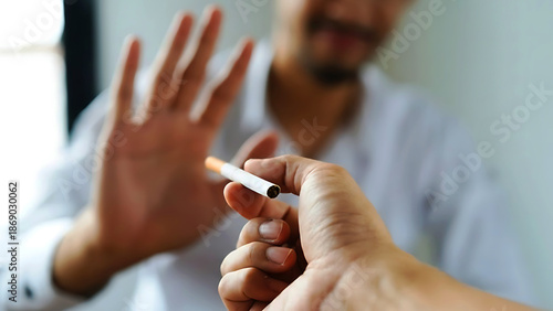 Close-up of a person rejecting a cigarette offered by another hand, symbolizing quitting smoking, healthy choices, and prevention of tobacco addiction.