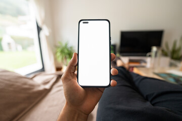 Hand holding smartphone with blank white screen displaying content