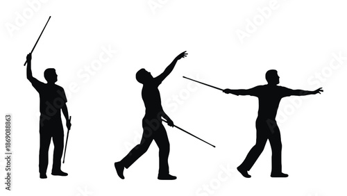 A group of silhouetted men performing a martial arts routine with sticks