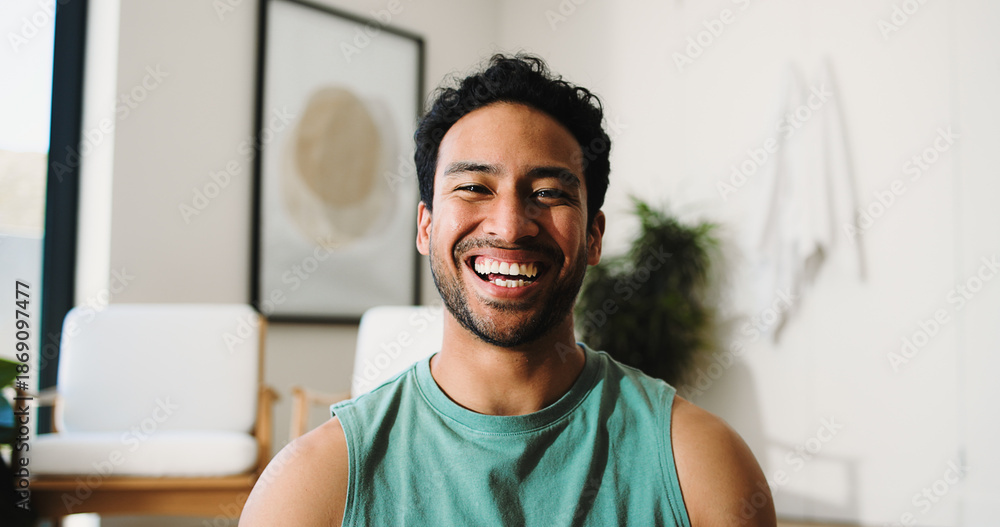 © BuyOutFelix06/peopleimages.com - Property, portrait and man in living room with pride, fresh start and investment in dream house. Success, real estate and happy male with confidence, relocation and achievement for new homeowner.