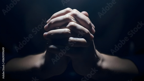 Hands Clasped Together In Darkness Representing Prayer Hope Faith And Deep Emotional Reflection