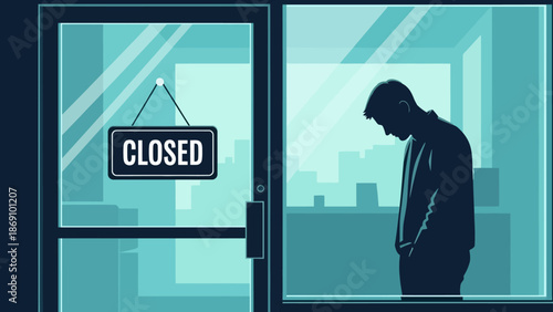 A man stands alone in a dimly lit office space gazing down beside a closed door with a sign indicating it is shut