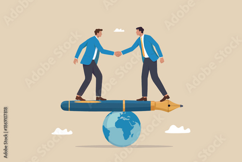 Global business partnership: two businessmen shaking hands on a pen balanced on a globe