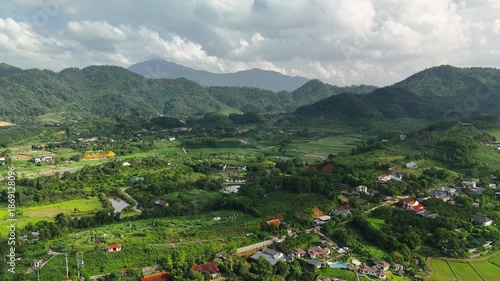 Aerial view of lush green rice fields and mountains in Ba Vi, Hanoi.