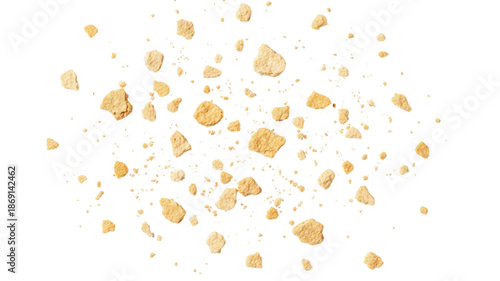 Scattered Golden Brown Cookie Crumbles Isolated on White Background
