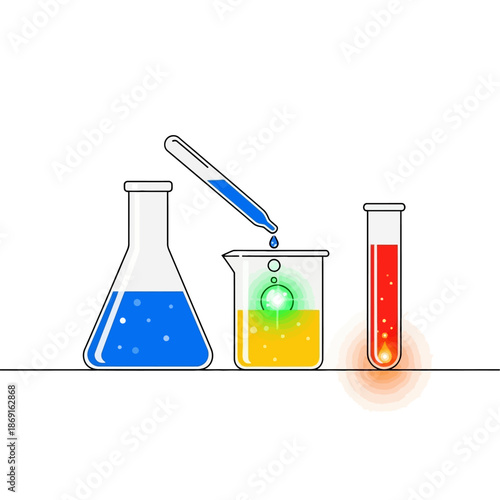 Laboratory glassware with colorful liquids and bubbling reaction