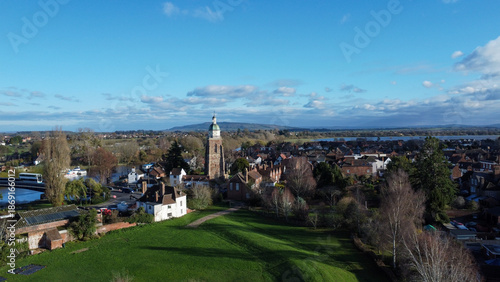 Aerial shot of church tower in a village