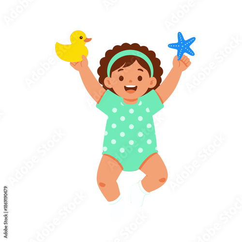 Happy baby girl holding duck toy and blue star