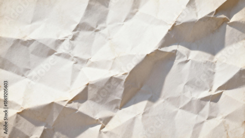 Close-up of crumpled white paper with textured folds and shadows