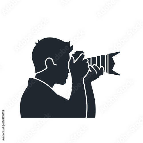 Silhouette of a photographer holding a professional camera and taking a photo