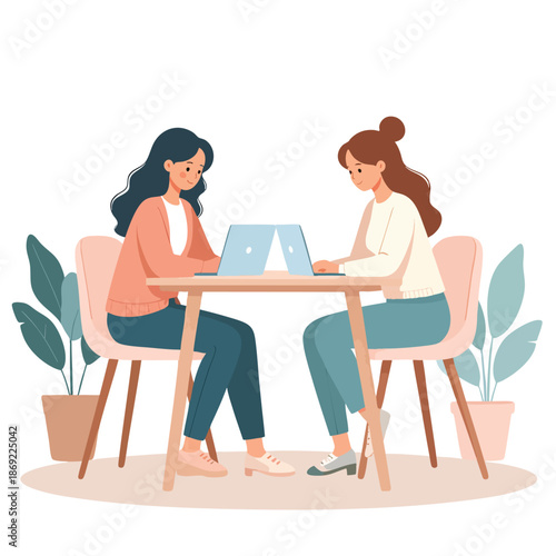 Two women collaborating on a project using laptops at an outdoor table surrounded by plants