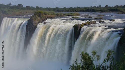 Victoria Falls Landscape with Water Cascading Down Rocks.