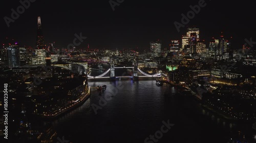 Aerial view of London skyline at night. Beautiful view of Tower Bridge and the City of London illuminated by city lights