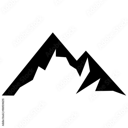 Majestic mountain peaks rising sharply against a clear sky viewed from a distance