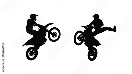 Two motocross riders performing stunts in mid air a striking silhouette