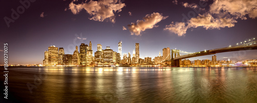 Downtown Manhattan night lights, panoramic view from Brooklyn Bridge Park