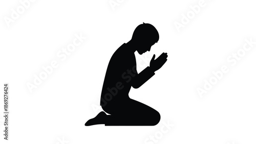 Silhouette of a man kneeling in prayer hands clasped together