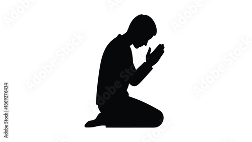 A silhouetted figure of a person kneeling in a posture of prayer or reverence