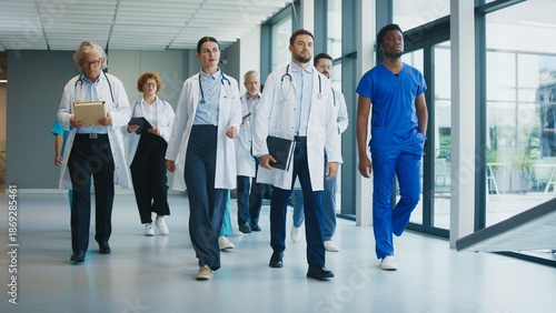 Canvastavla Medical staff walking through clinic hallway with focused expressions