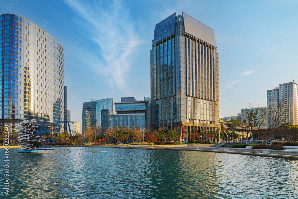 Obraz premium The skyline of modern urban architecture and the scenery of Jinji Lake in Suzhou, Jiangsu Province, China, on December 8, 2025 