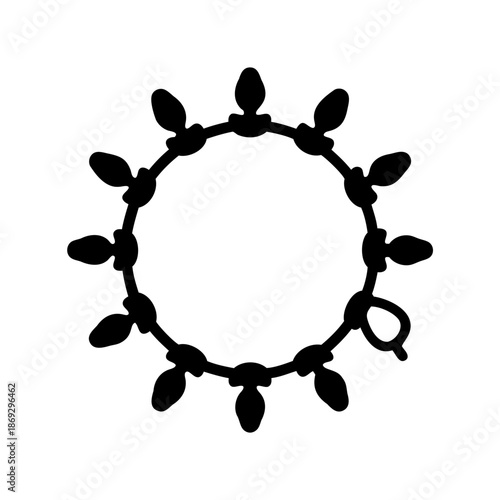 Circular strand of Christmas lights creates an open frame in black silhouette