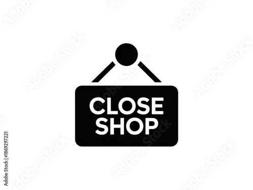 A black signboard with white text reading Close Shop hangs from a hook