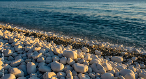 Close-up view of white marble pebbles on a beach meeting the dee
