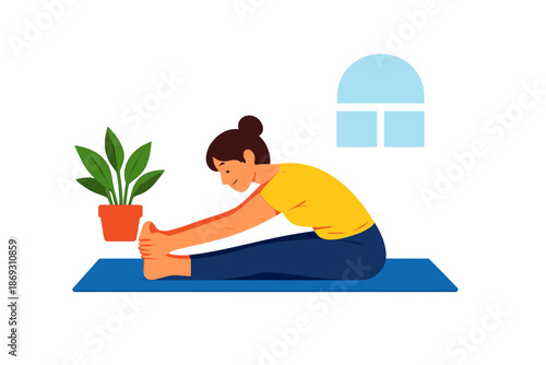 Woman doing seated forward bend yoga pose on mat with plant and window