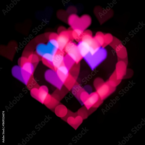 Vibrant and delicate heart shaped light bokeh with soft pink, blue, and purple glows, blending harmoniously to evoke a romantic and intimate mood, with gentle, feathery edges and a warm, ethereal