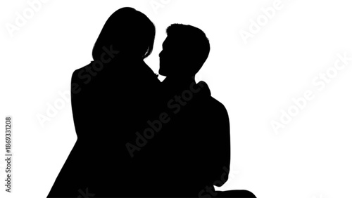 Romantic silhouette of a couple in a tender embrace against a bright white backdrop