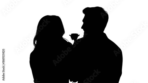 Romantic silhouette of a couple with a rose, symbolizing love and affection