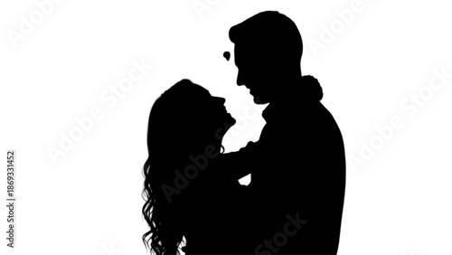 Silhouette of an affectionate couple embracing and looking into each other's eyes