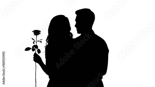 A romantic silhouette of a couple in love, with the woman holding a delicate rose