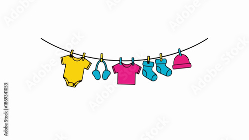 Colorful baby clothes and accessories hang on a clothesline